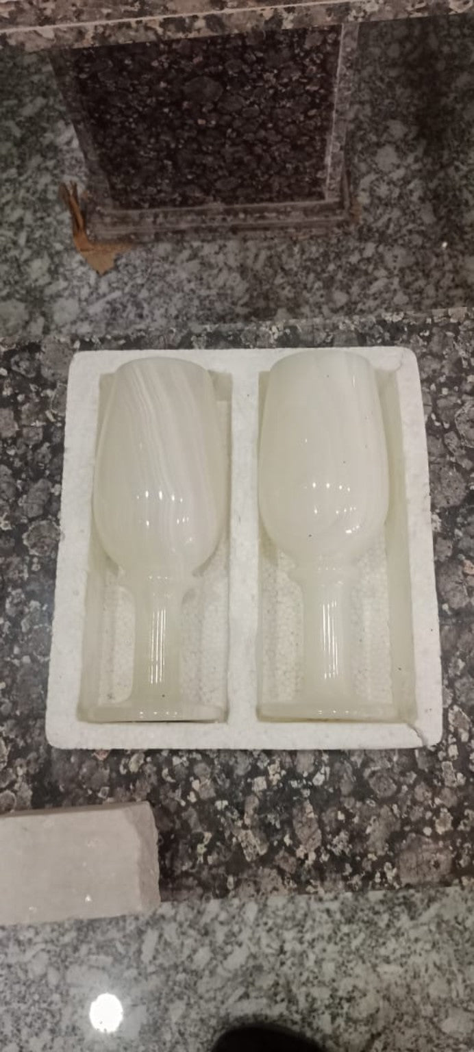 Pair of pale carved goblets