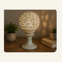 Hand-carved marble jaali lamp illuminated in a home setting